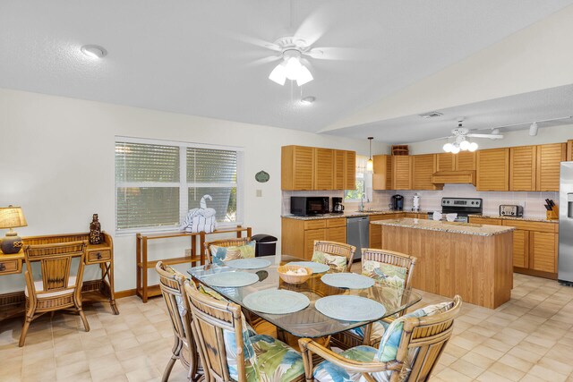 444 Calle De Luna, Marathon, FL 33050 - dining room with a toaster, light floors, vaulted ceiling, visible vents, and ceiling fan