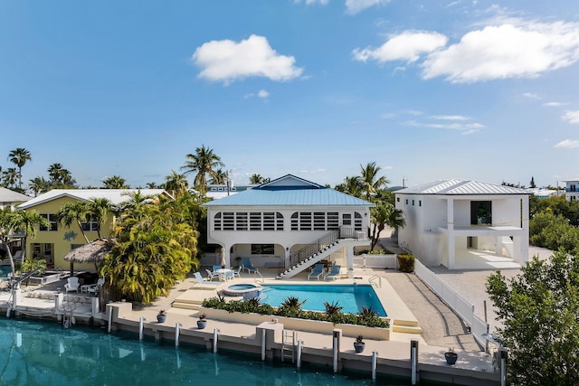 444 Calle De Luna, Marathon, FL 33050 - rear view of house with an outdoor pool, a patio, stairs, and metal roof