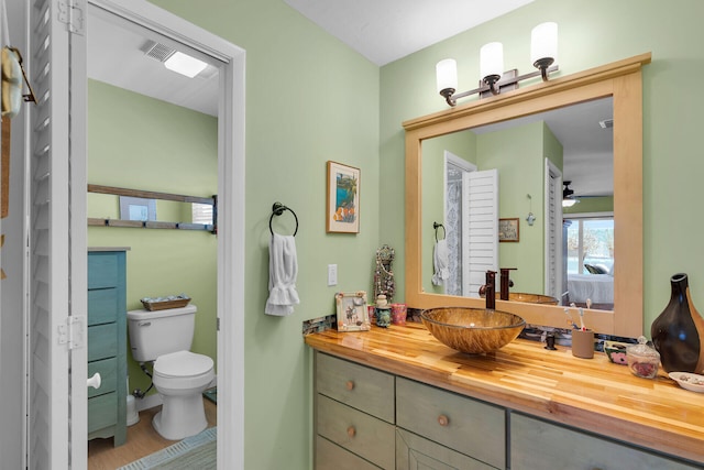 31135 Hollerich Dr, Big Pine, FL 33043 - ensuite bathroom with vanity, toilet, and wood finished floors