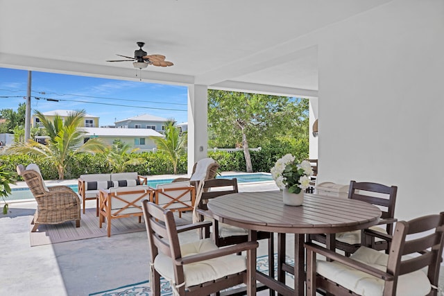 view of patio with ceiling fan and an outdoor living space