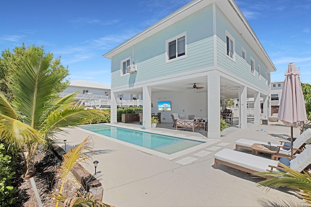 view of pool with an outdoor hangout area, a patio area, and ceiling fan