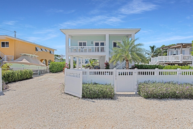 view of front of home featuring a balcony