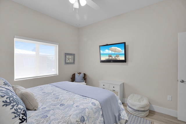 bedroom featuring ceiling fan and light hardwood / wood-style flooring