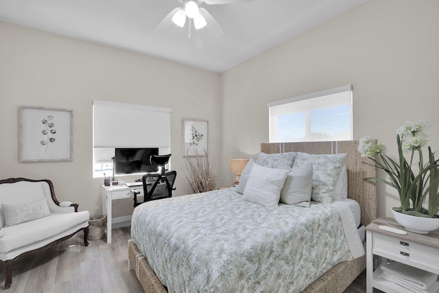 bedroom featuring ceiling fan and light hardwood / wood-style flooring