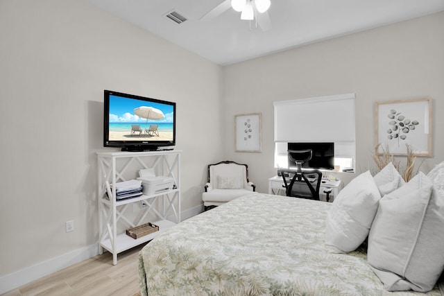 bedroom with ceiling fan and light hardwood / wood-style floors