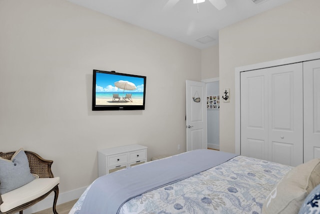 bedroom with ceiling fan and a closet