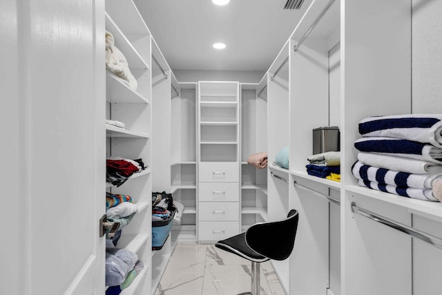 walk in closet featuring marble finish floor and visible vents