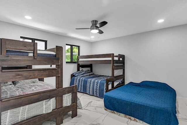 bedroom with recessed lighting, marble finish floor, and ceiling fan