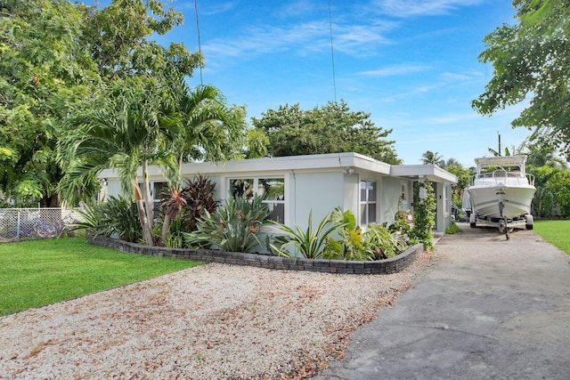 view of front of home with a front lawn