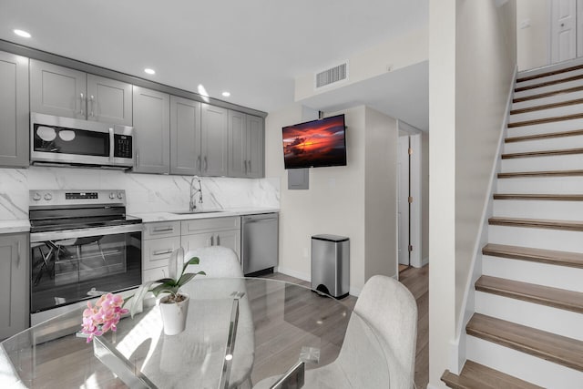 3314 Northside Dr Unit 53, Key West, FL 33040 - kitchen with gray cabinets, recessed lighting, visible vents, appliances with stainless steel finishes, and a sink