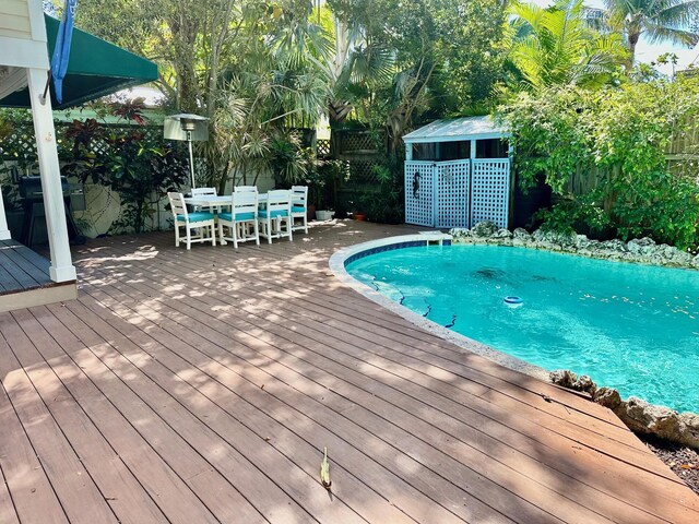 1122 Margaret St, Key West, FL 33040 - view of swimming pool featuring fence, a deck, and outdoor dining area