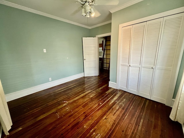 1122 Margaret St, Key West, FL 33040 - unfurnished bedroom featuring a closet, baseboards, a ceiling fan, dark wood-style floors, and crown molding