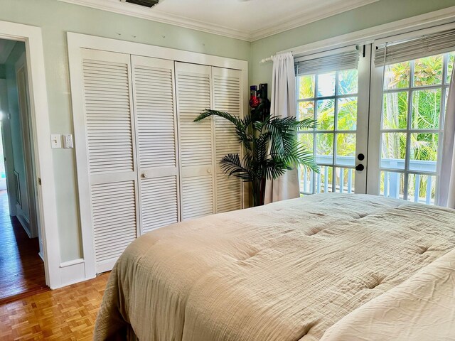 1122 Margaret St, Key West, FL 33040 - bedroom featuring a closet, visible vents, baseboards, ornamental molding, and access to exterior