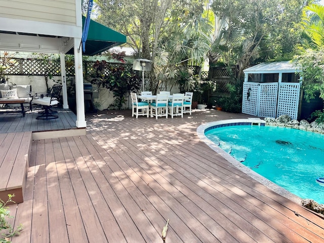 1122 Margaret St, Key West, FL 33040 - view of pool featuring a wooden deck, fence, and outdoor dining area