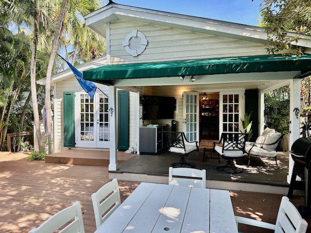 1122 Margaret St, Key West, FL 33040 - rear view of property featuring a deck, french doors, and outdoor dining area