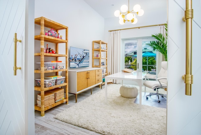 office area featuring an inviting chandelier and light hardwood / wood-style floors