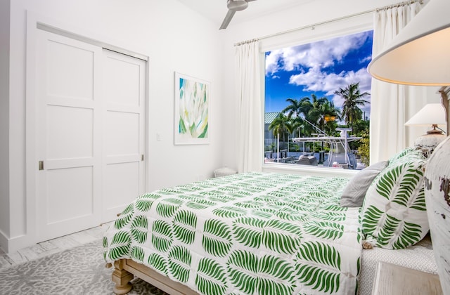 bedroom featuring multiple windows and a closet