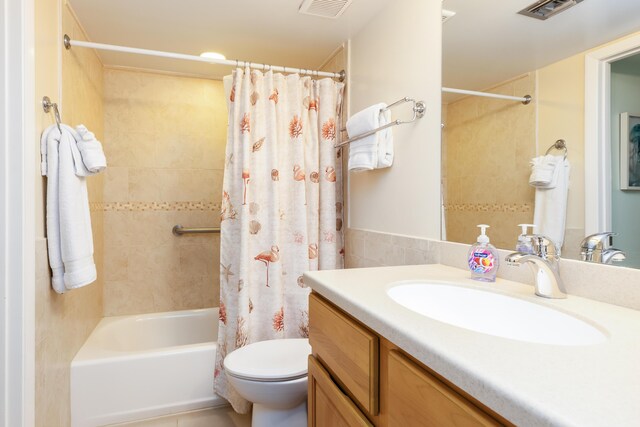 full bathroom featuring vanity, toilet, and shower / tub combo