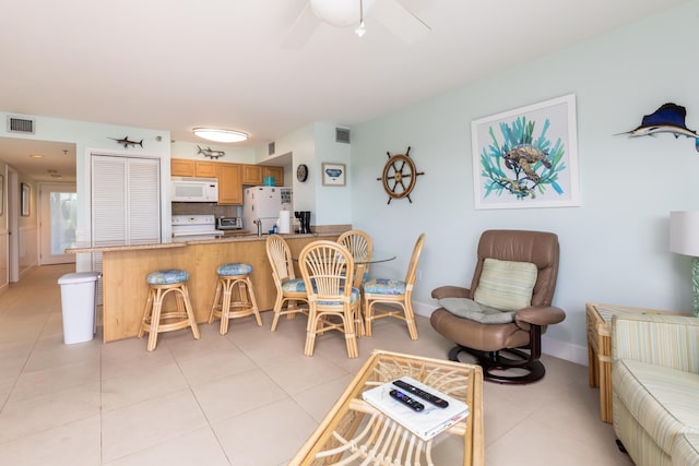 living room with light tile patterned flooring and ceiling fan