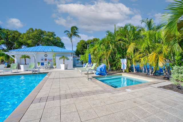 view of swimming pool featuring a patio area