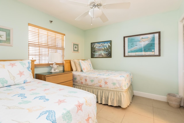 tiled bedroom with ceiling fan