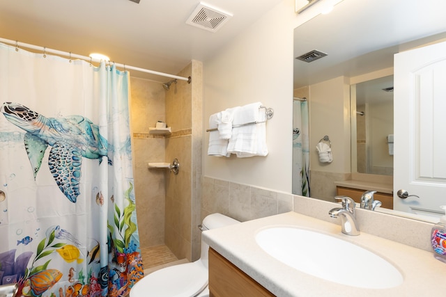 bathroom featuring a shower with curtain, vanity, and toilet