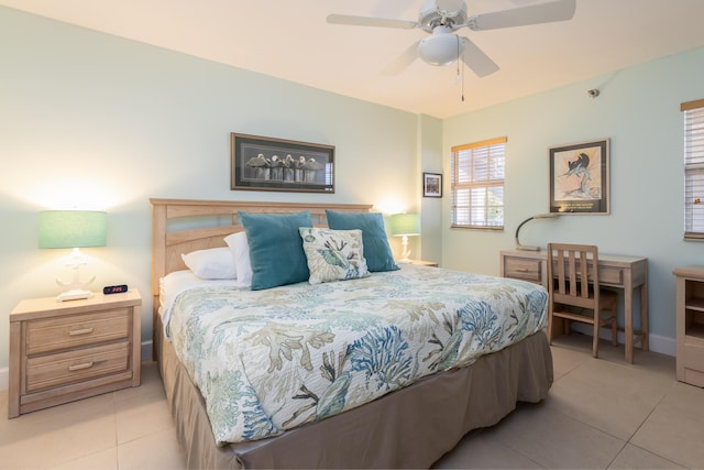 bedroom with ceiling fan and light tile patterned floors