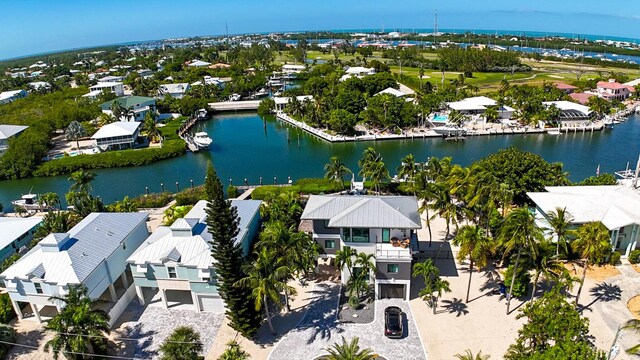 bird's eye view featuring a water view and a residential view