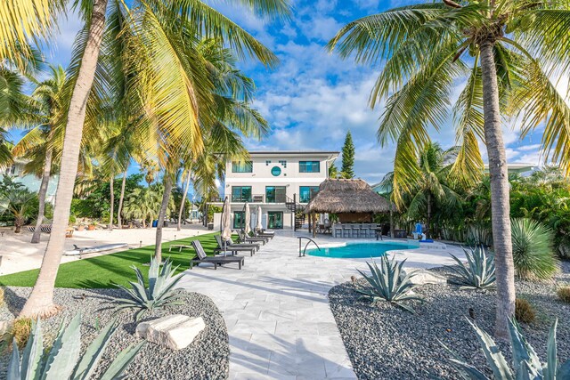 outdoor pool featuring a gazebo and a patio area