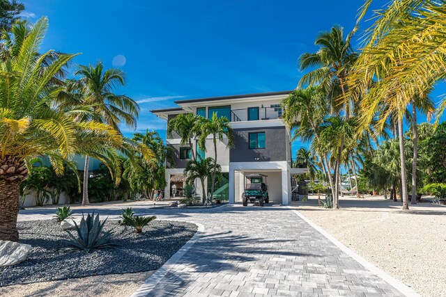 view of property featuring decorative driveway