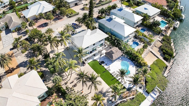 bird's eye view with a water view and a residential view