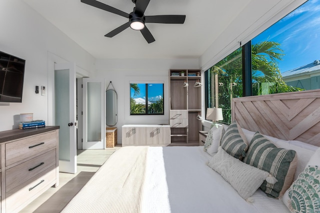 bedroom featuring a ceiling fan and light wood-style flooring