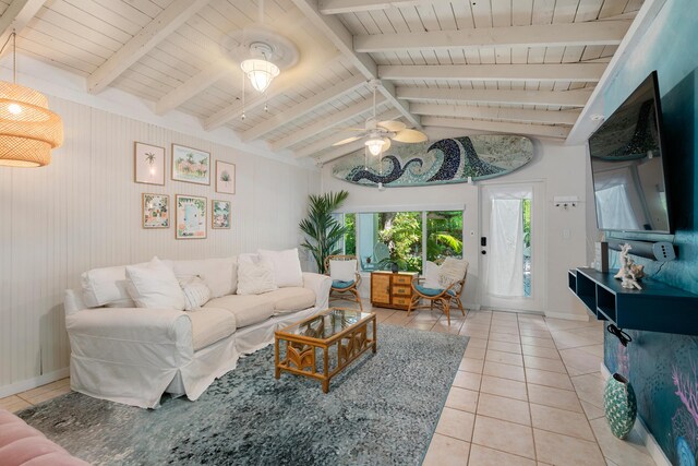 living room featuring vaulted ceiling with beams, ceiling fan, tile patterned floors, and plenty of natural light