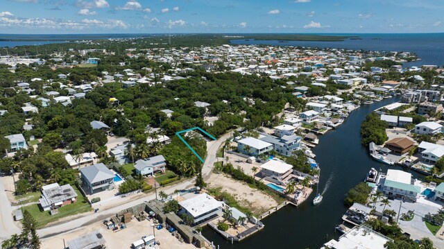 aerial view featuring a water view and a residential view