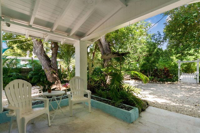 view of patio / terrace featuring fence