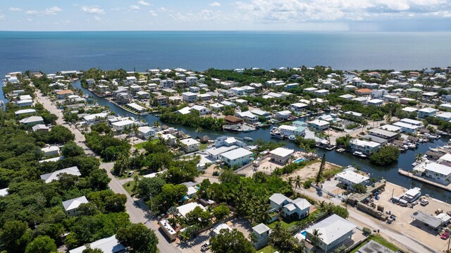 aerial view with a water view and a residential view