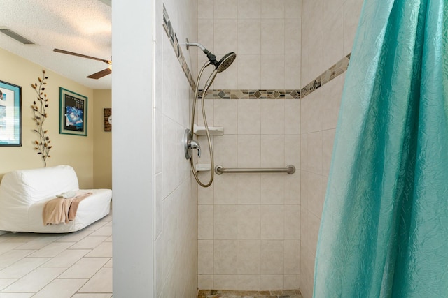 bathroom featuring a textured ceiling, ceiling fan, and a shower with shower curtain