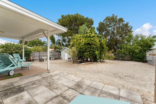 view of patio / terrace featuring a storage shed