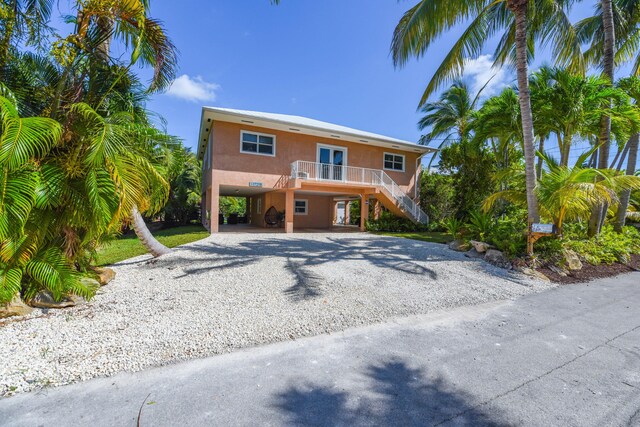 view of front of home with a carport