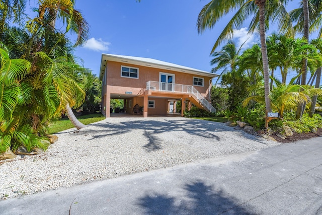 view of front of home with a carport