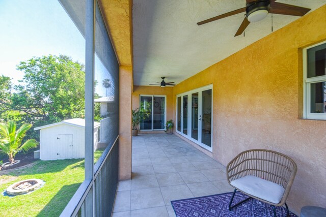 balcony with a patio and ceiling fan