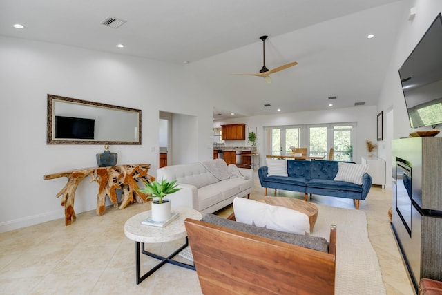 living room with vaulted ceiling and ceiling fan