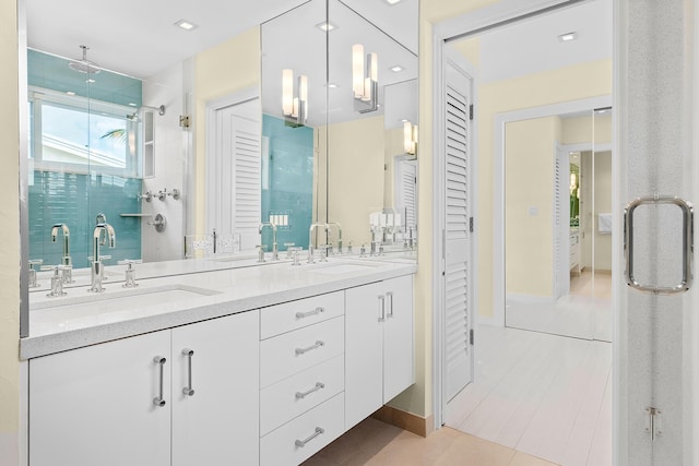 bathroom with vanity and an enclosed shower