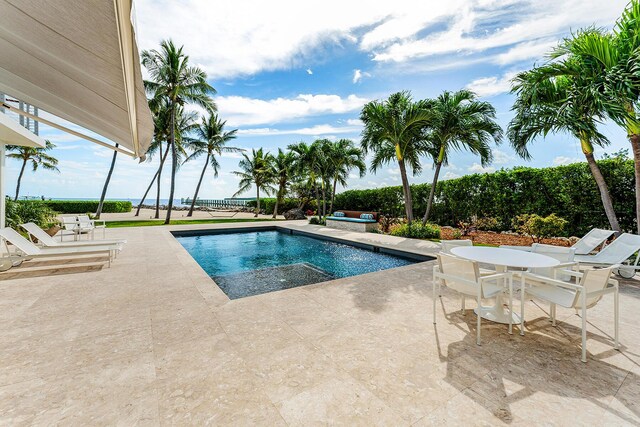 view of swimming pool featuring a patio