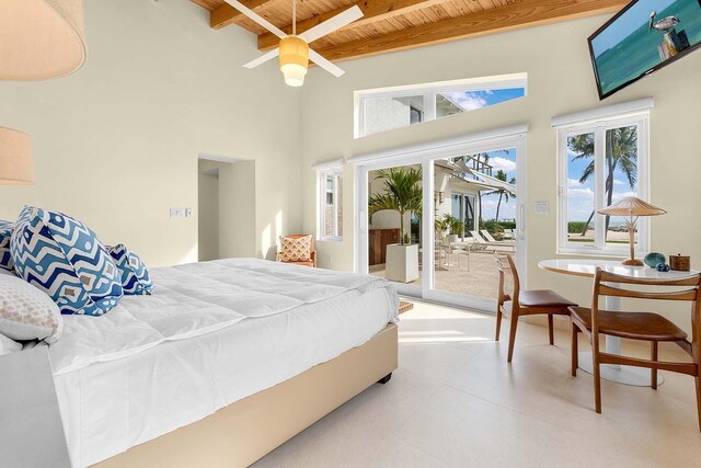 bedroom featuring access to exterior, a high ceiling, beam ceiling, and wooden ceiling