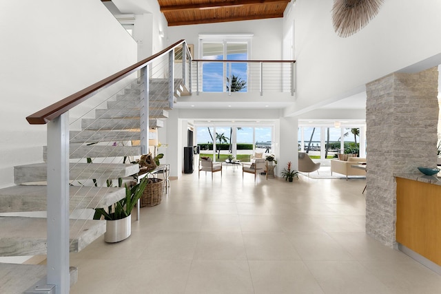 tiled foyer featuring wooden ceiling and beamed ceiling