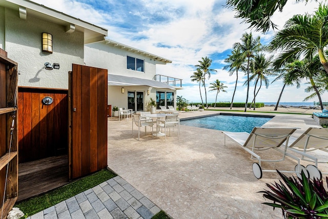 view of swimming pool with a patio area