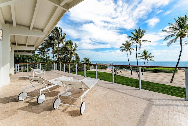 view of patio with a water view