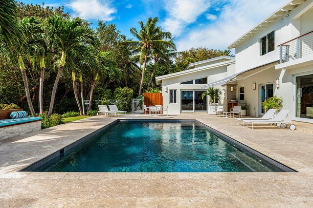 view of swimming pool with a patio area