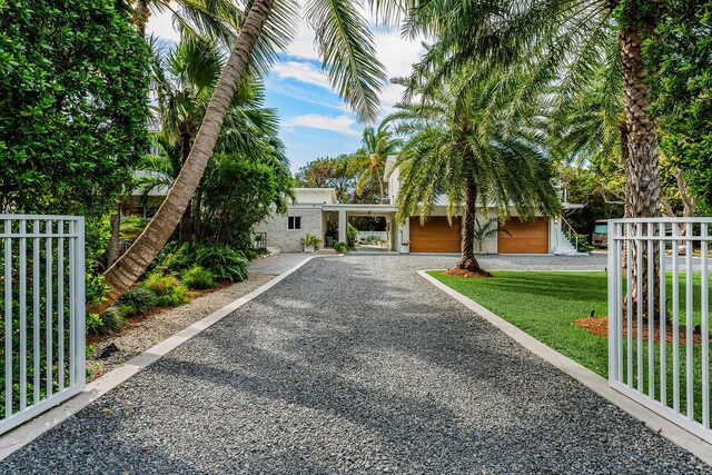 view of front of property with a garage and a front yard